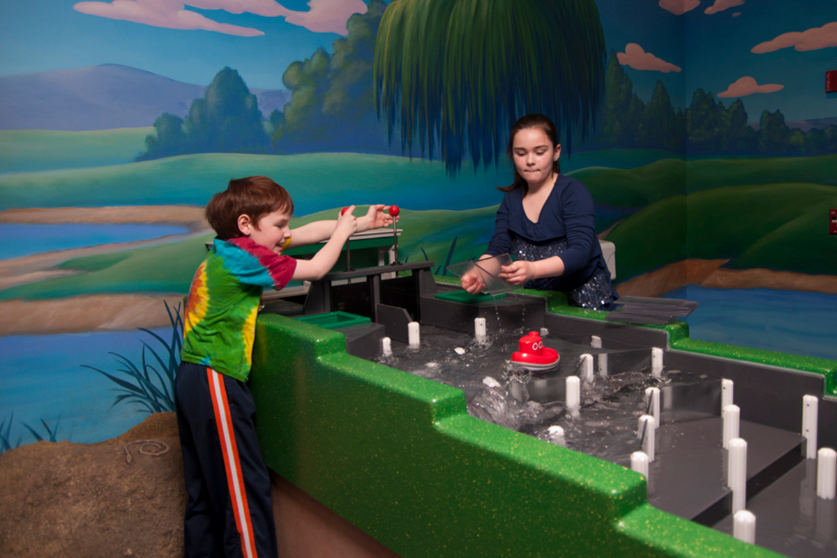 children playing with the sluiceway